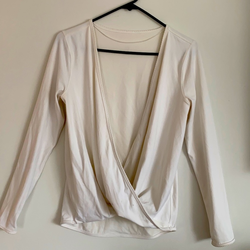 Lululemon size 8 cross over front. It is not bright white a bit dull
